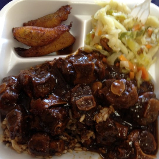Photo taken at Golden Krust Caribbean Restaurant by Kam B. on 4/16/2012