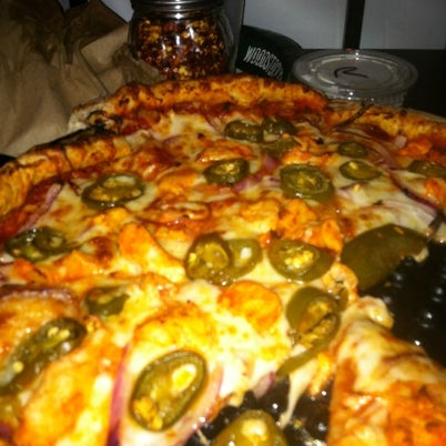 Photo taken at Woodstock&#39;s Pizza by William on 8/9/2012