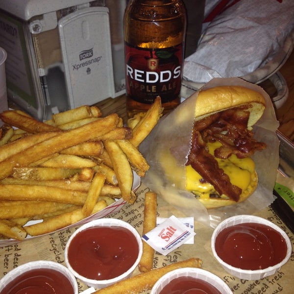 Photo taken at BurgerFi by Gaelyn D. on 2/27/2014