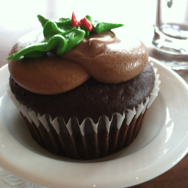 Photo taken at Indulgence Pastry Shop &amp; Cafe by Erin S. on 12/27/2012