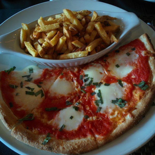 Marguerita demi pizza with fries is a must! Delicious tomato sauce! 🍅