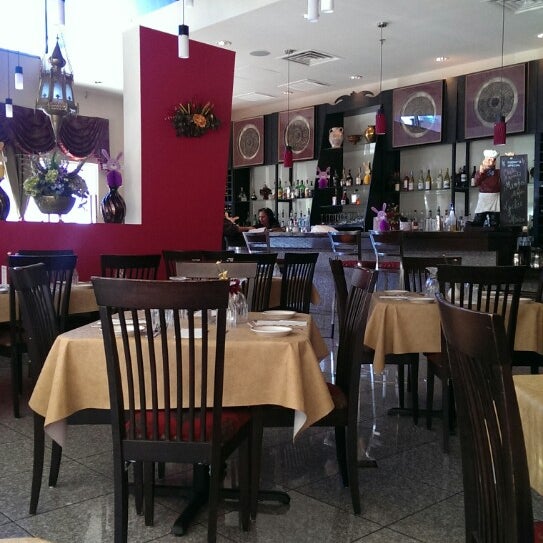 Photo taken at Mughlai Restaurant by Kristina W. on 4/15/2014