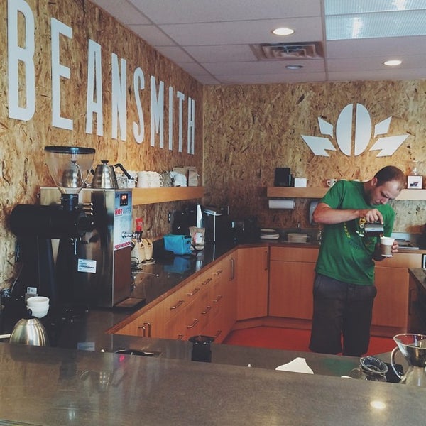Photo taken at Beansmith Coffee Roasters by Ben R. on 6/28/2014