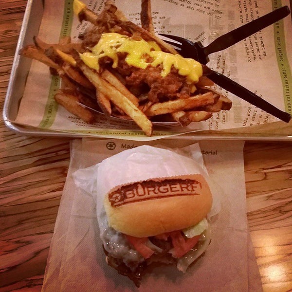 Photo taken at BurgerFi by JettaJimm V. on 9/23/2014