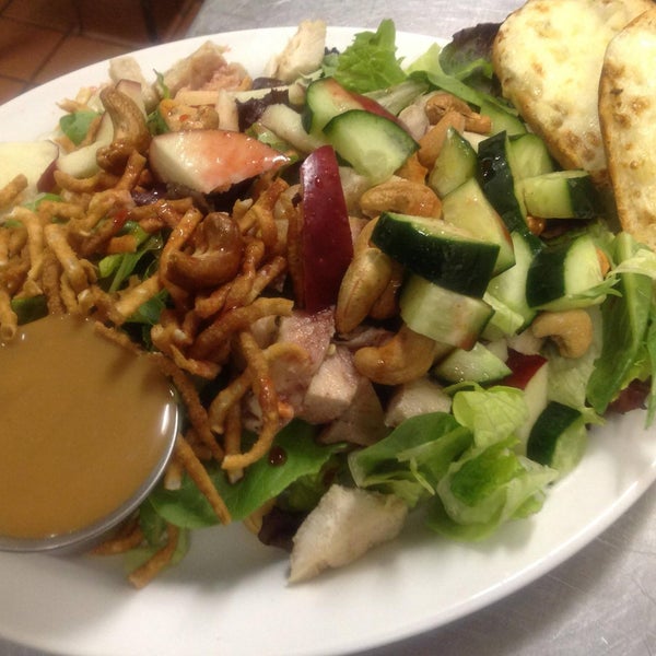 Thai Spring Apple salad w/seasoned chicken, crisp apples, roasted cashews, cucumbers & crunchy noodles with spicy raspberry vinaigrette drizzle & creamy peanut dressing on the side