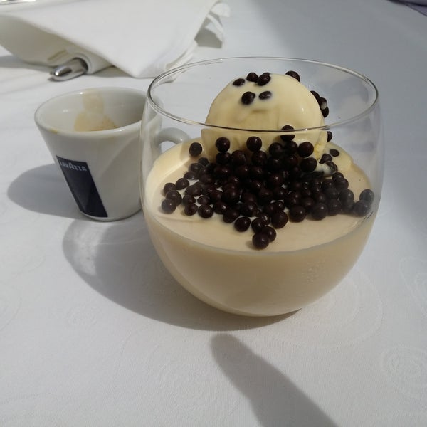 Dessert white chocolate]  mousse with baileys poured over with espresso