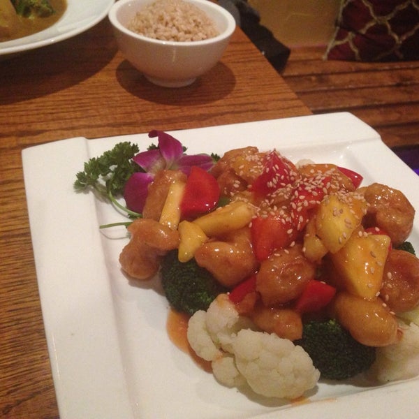 Photo taken at Wild Ginger Pan-Asian Vegan Cafe by Ashley W. on 3/13/2014