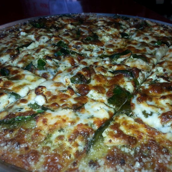 April POM: Chicken Pesto Pizza - Fresh grilled chicken, pesto/olive oil base, mozzarella cheese and fresh spinach.
