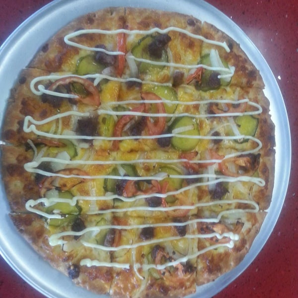 Feb POM: Cheeseburger Pizza - Cheddar Cheese, Pizza Cheese, Ground Beef, Pickle, Onion, Tomato, and Mayo.