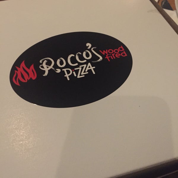Photo taken at Rocco&#39;s Wood Fired Pizza by Michelle D. on 1/10/2018