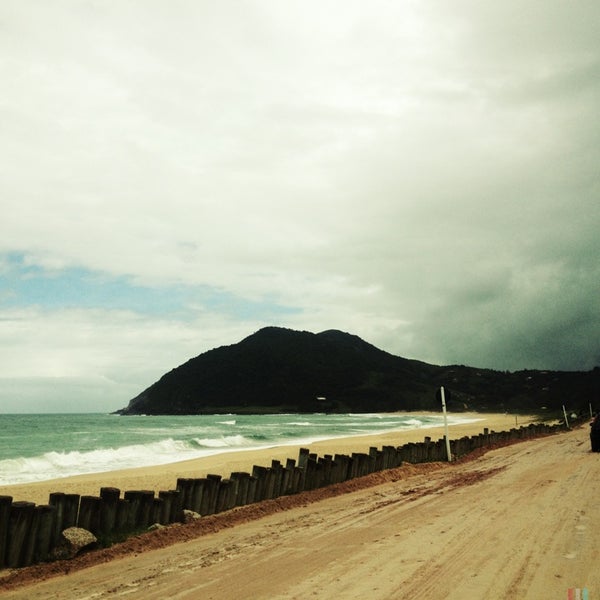 Photo taken at Praia da Silveira by Clau S. on 1/9/2013