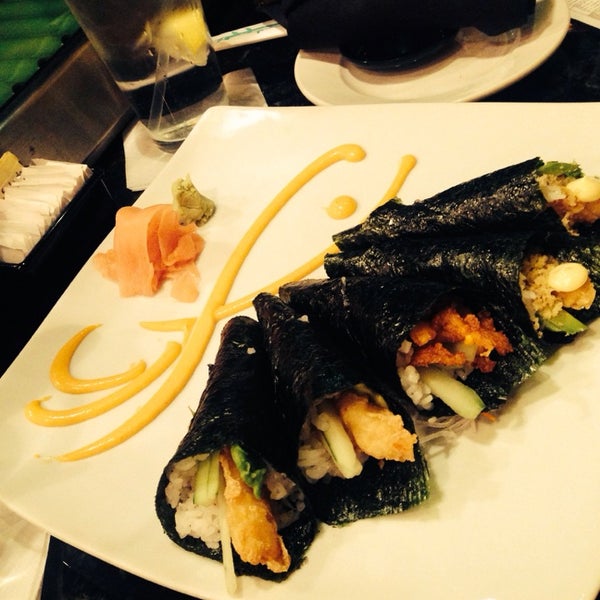 Photo taken at Takara Sushi &amp; Sake Lounge by Monique C. on 4/27/2014