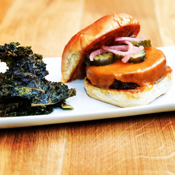 New dinner menu. Veggie Burger - quinoa & chickpeas with roasted mushrooms, cauliflower, kale & carrots seasoned with classic Indian spices. Served with kale chips, pickled onions and charred cabbage