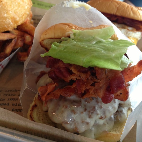 Photo taken at BurgerFi by Abby R. on 2/1/2014