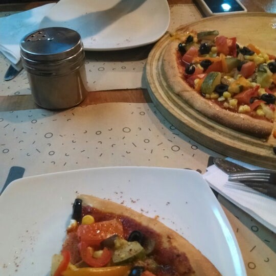 Photo taken at Manouche Pizza Club by Martha G. on 5/27/2014
