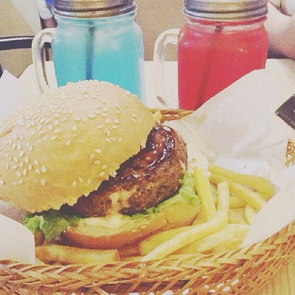 Photo taken at Stuff Over Burger Cafe by Raia T. on 6/30/2014