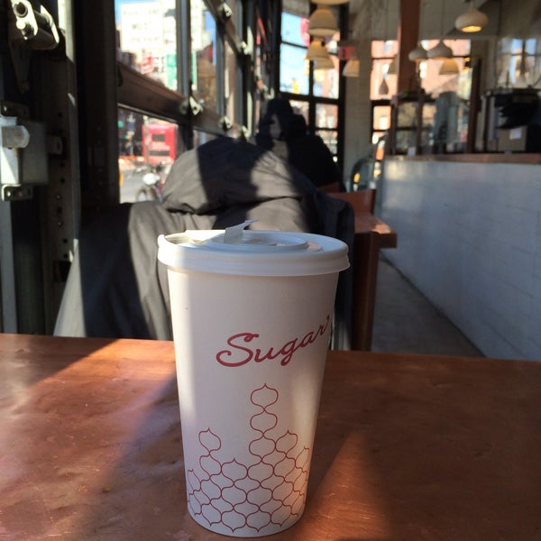 Photo taken at Sugar Cafe by Justin T. on 2/20/2015