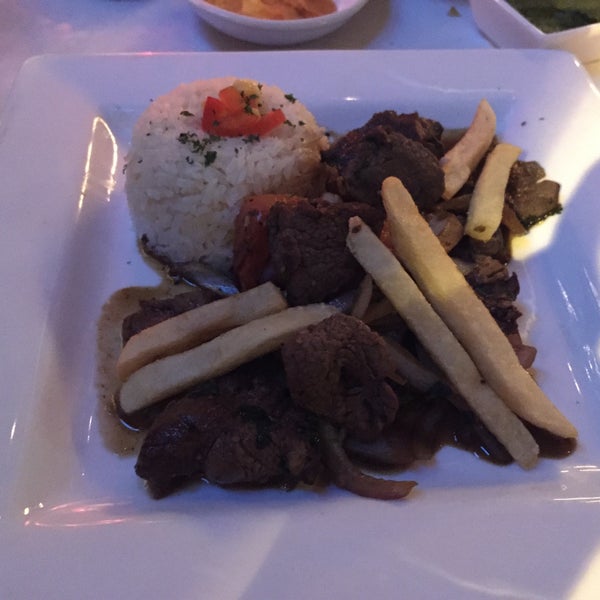 Photo taken at Mango Peruvian Cuisine by Gary F. on 3/10/2015