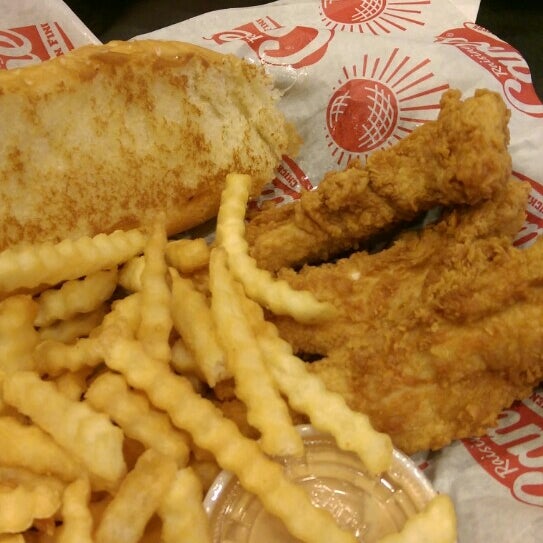 Photo taken at Raising Cane&#39;s Chicken Fingers by Orville H. on 12/27/2015