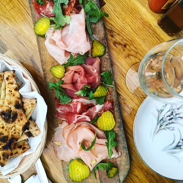 Apart from the pizza, also try their delicious charcuterie platter with bread