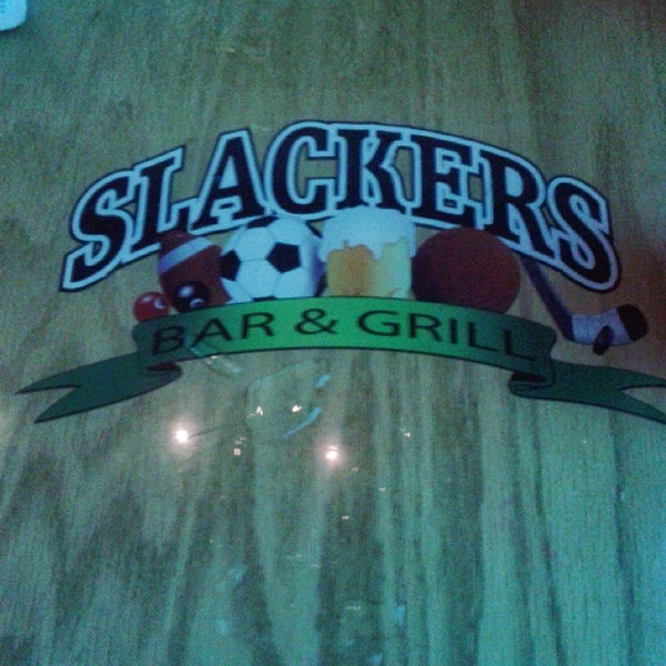 Photo taken at Slackers Bar &amp; Grill by Natasha F. on 12/24/2014