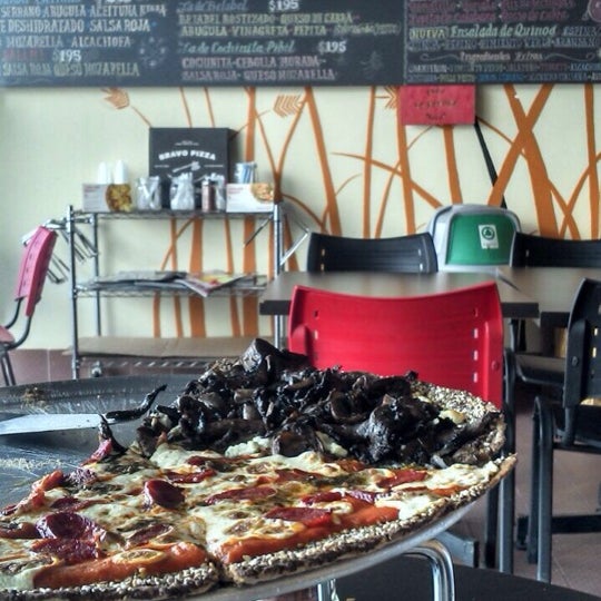 Photo taken at Bravo Pizza by Citlally H. on 7/24/2014