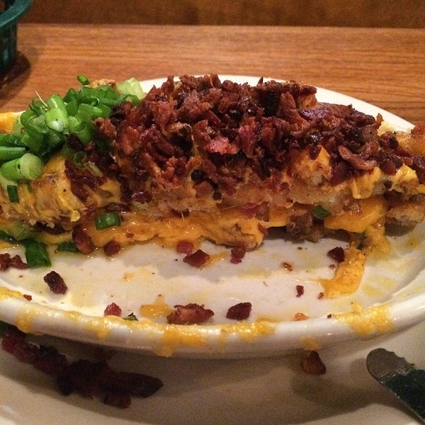 Photo taken at Snuffers by Julie M. on 12/13/2014
