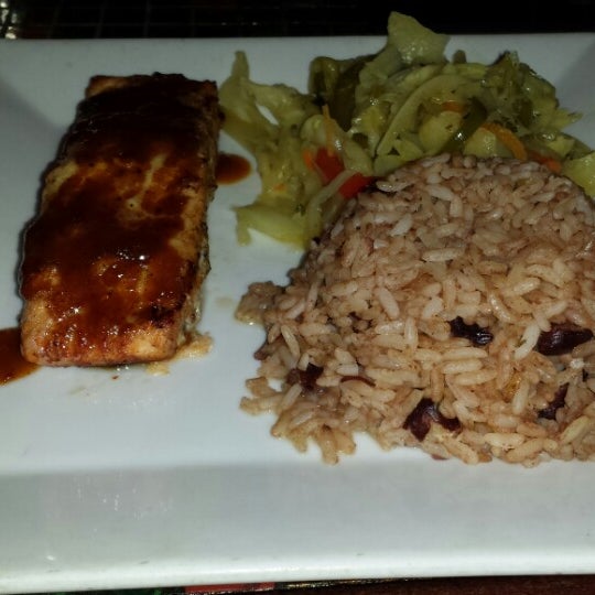 Photo taken at Reef Caribbean Restaurant And Lounge by Rob C. on 3/8/2014