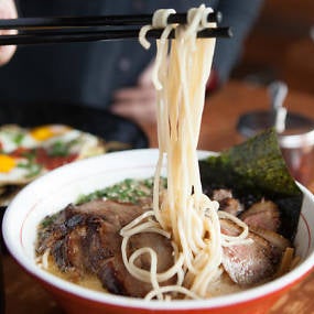 The menu offers three base options: light seaweed broth, miso-based chicken and turkey stock, and rich pork bone broth. If you can handle intense heat, ask for the Monster Hell Ramen.