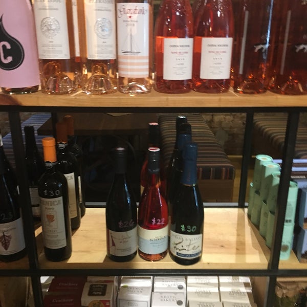 Photo taken at Cork Wine Bar and Market by Cesar C. on 5/19/2019