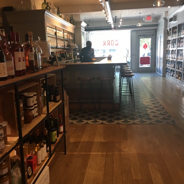 Photo taken at Cork Wine Bar and Market by Cesar C. on 5/19/2019