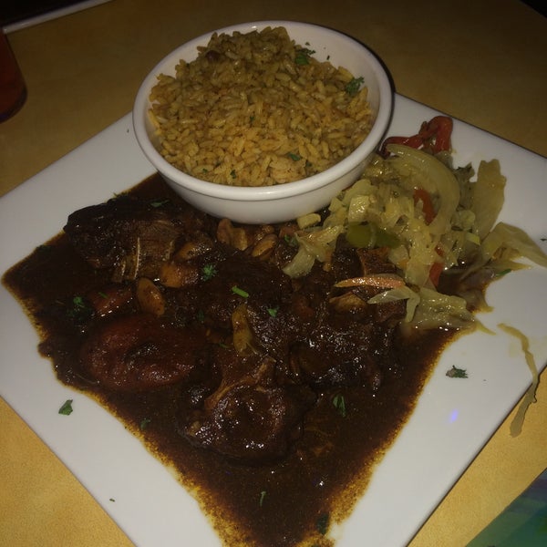 Photo taken at Reef Caribbean Restaurant And Lounge by Keeks B. on 4/26/2015