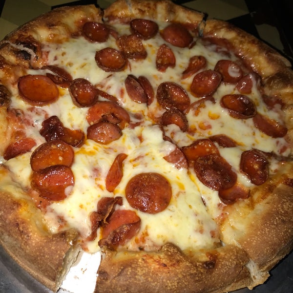 Pepperoni and cheese pizza. The cheese is melty and gooey. Open late.