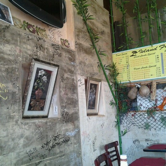Photo taken at Wi Jammin Caribbean Restaurant by KingofPico M. on 10/12/2012