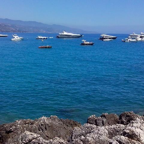 Photo taken at Plage de Roquebrune Cap Martin by Saša S. on 8/2/2014