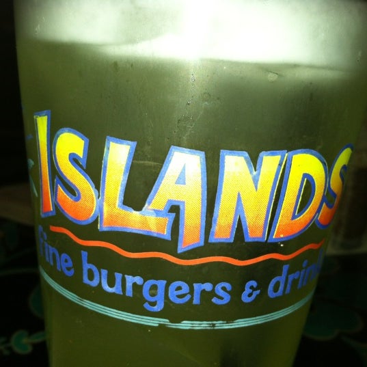 Photo taken at Islands Restaurant Long Beach Towne Center by Amanda W. on 10/30/2012