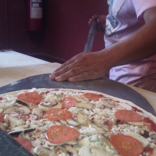 Photo taken at BRICO Pizzería Restaurant by Nayeli M. on 6/11/2014