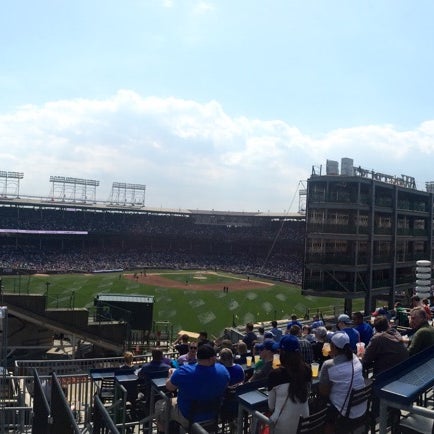 Photo taken at Wrigley Rooftops 1010 by Jessie B. on 4/20/2015