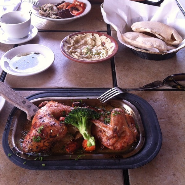 Photo taken at Khoury&#39;s Mediterranean Restaurant by Leslie S. on 5/24/2014