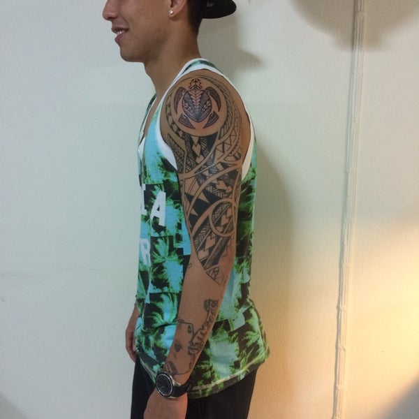 Photo taken at Bangkok Tattoo Studio 13 Thailand by Kyosai B. on 8/13/2014