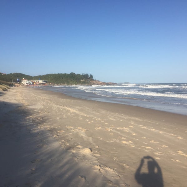 Photo taken at Praia da Joaquina by Marcelo V. on 12/3/2019