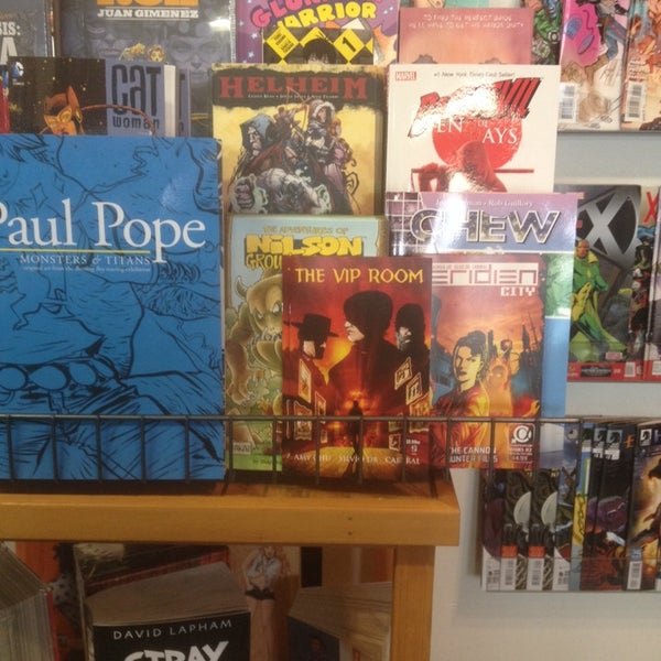 Photo taken at Floating World Comics by Amy C. on 4/1/2014