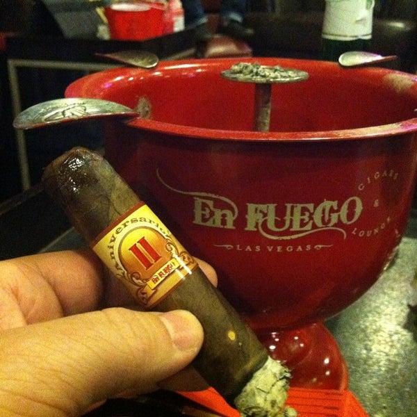 Photo taken at En Fuego Cigars &amp; Lounge by David S. on 3/1/2014