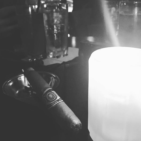 Photo taken at SoHo Cigar Bar by D N. on 12/12/2015