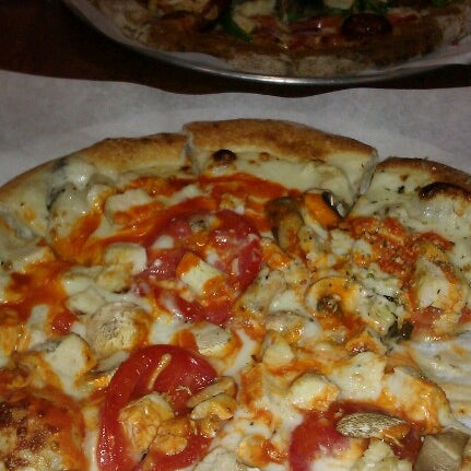 Photo taken at Custom Built Pizza by Heather B. on 2/20/2013