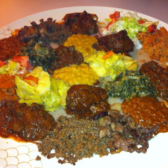 Photo taken at Messob Ethiopian Restaurant by Norman H. on 10/29/2012