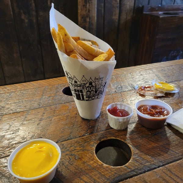 Photo taken at Pommes Frites by Ashly P. on 1/1/2023