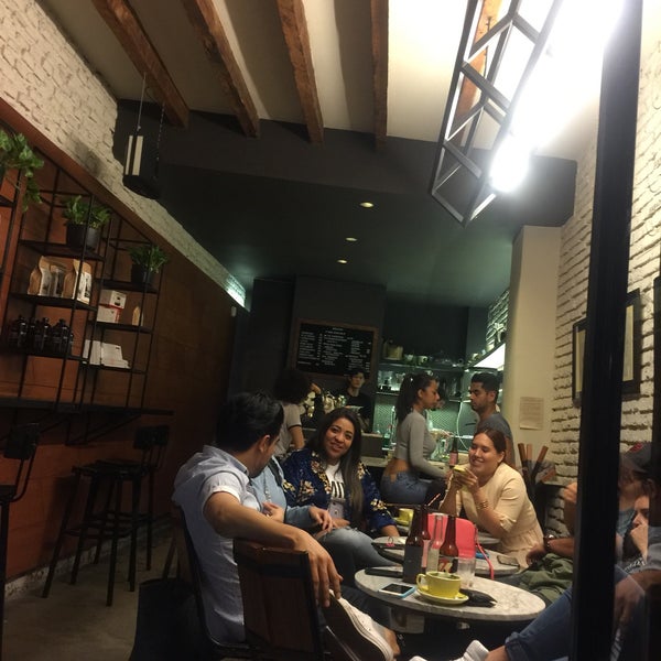 Photo taken at Qūentin Café by Lola B. on 3/18/2019