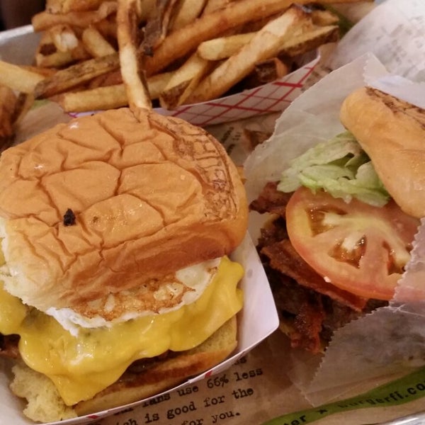 Photo taken at BurgerFi by Sarah B. on 8/3/2014