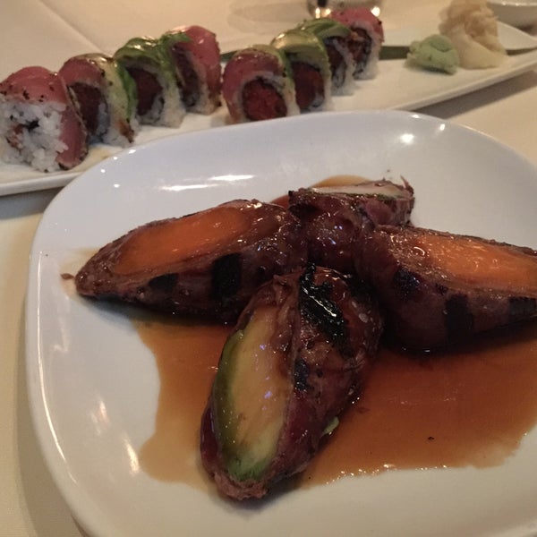 Photo taken at Uptown Sushi by Allen A. on 4/12/2015